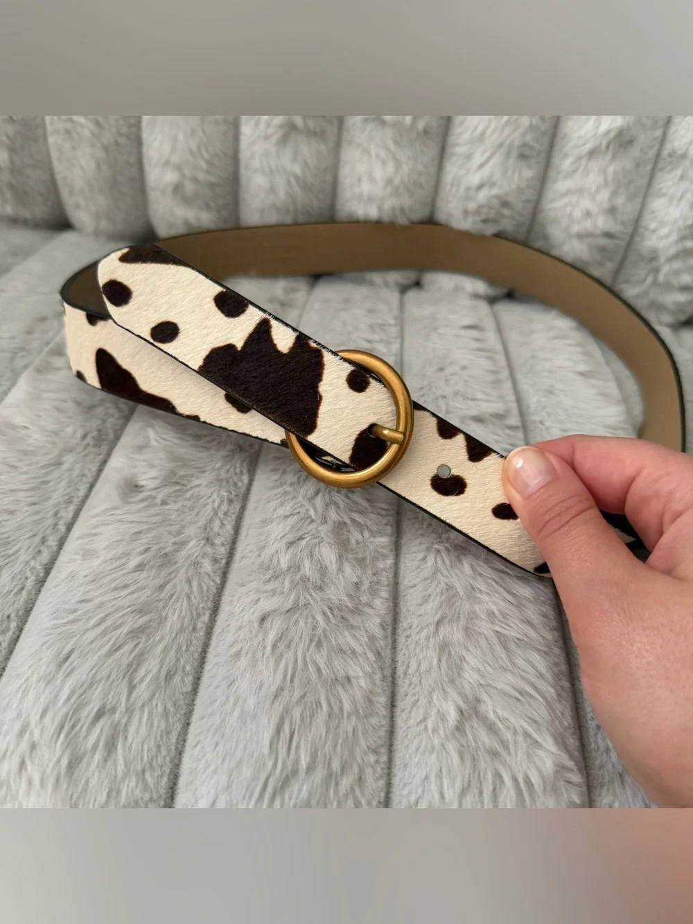 Urban Outfitters leather cow print calf hair belt.
